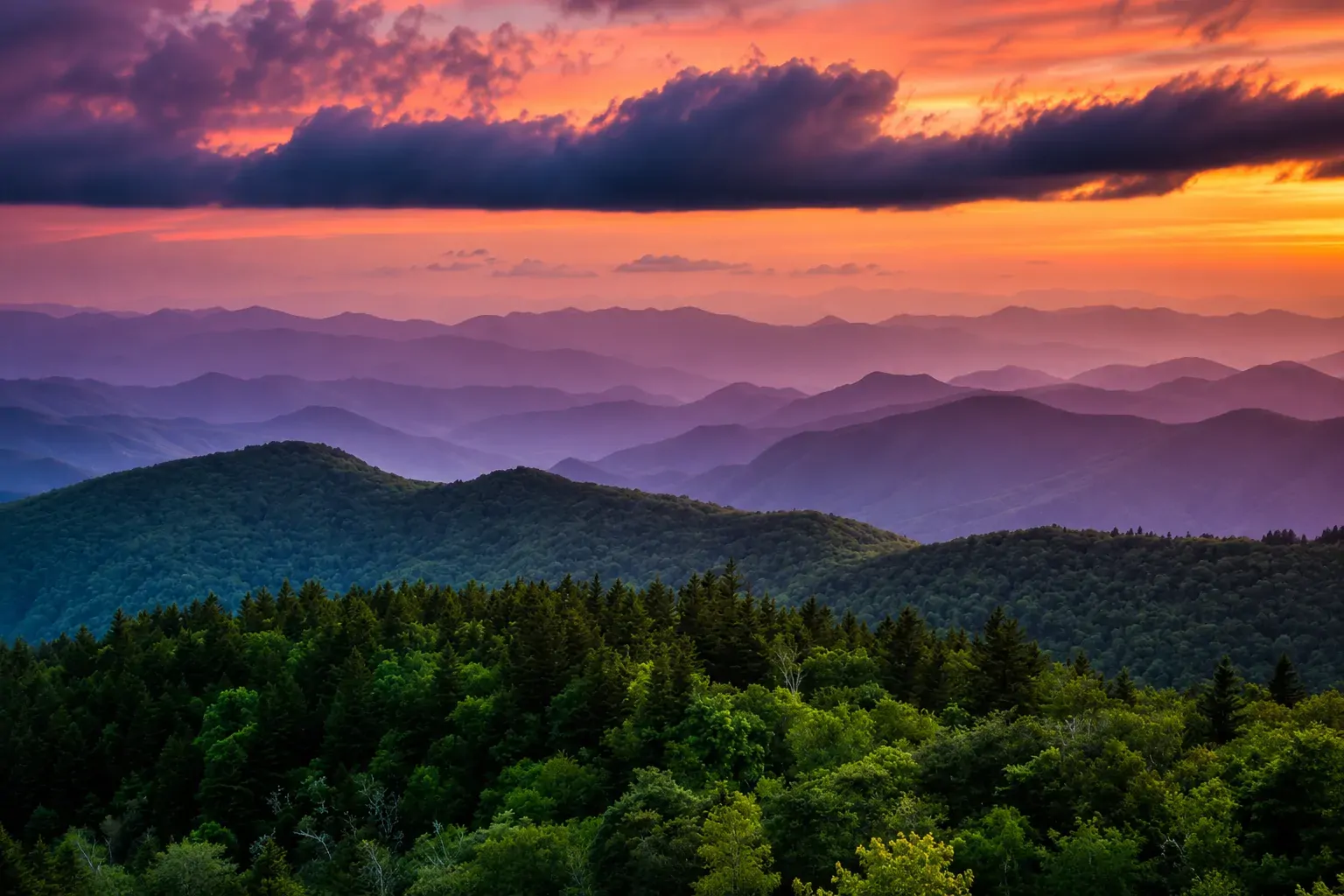 Sunset over misty Blue Ridge mountain ridges
